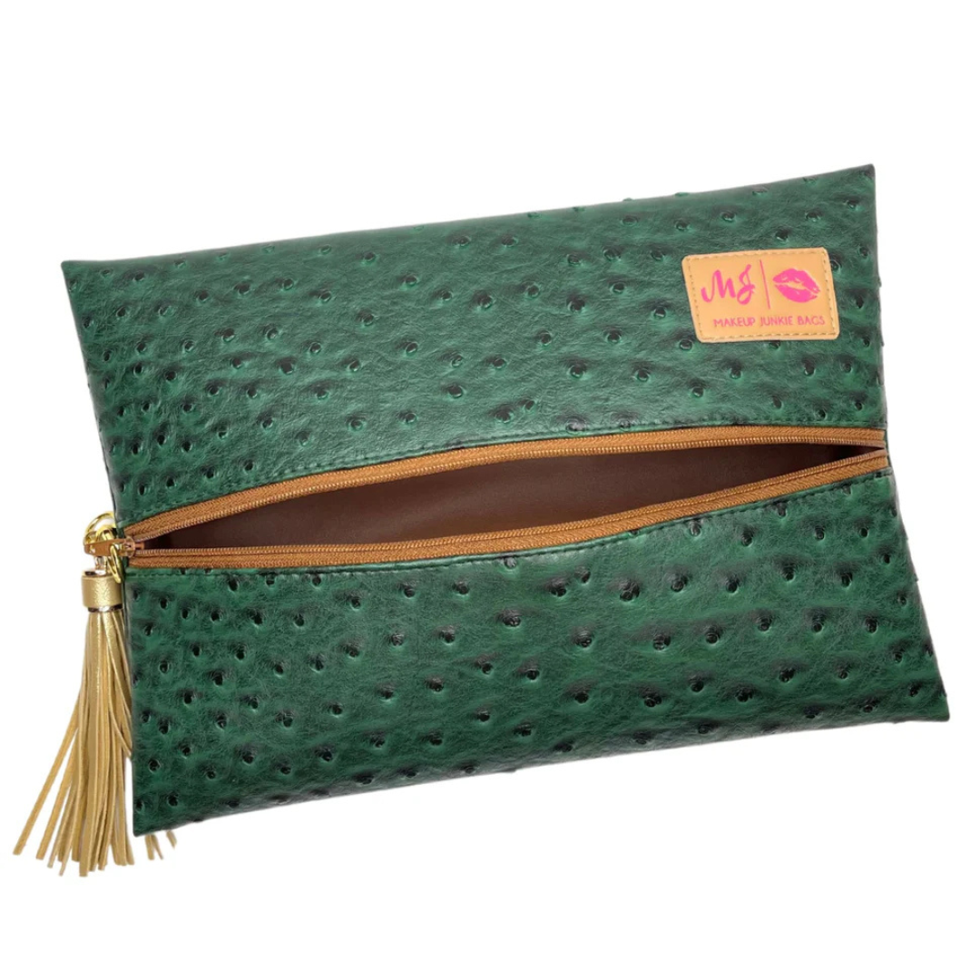 Front view of Arizona Makeup Junkie bag in desert-toned vegan ostrich texture with tan zipper and tassel.