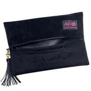 Elegant black velvet Audrey Hepburn Makeup Junkie travel bag with gold hardware and tassel zipper pull, flat‑lay design and velvet exterior.