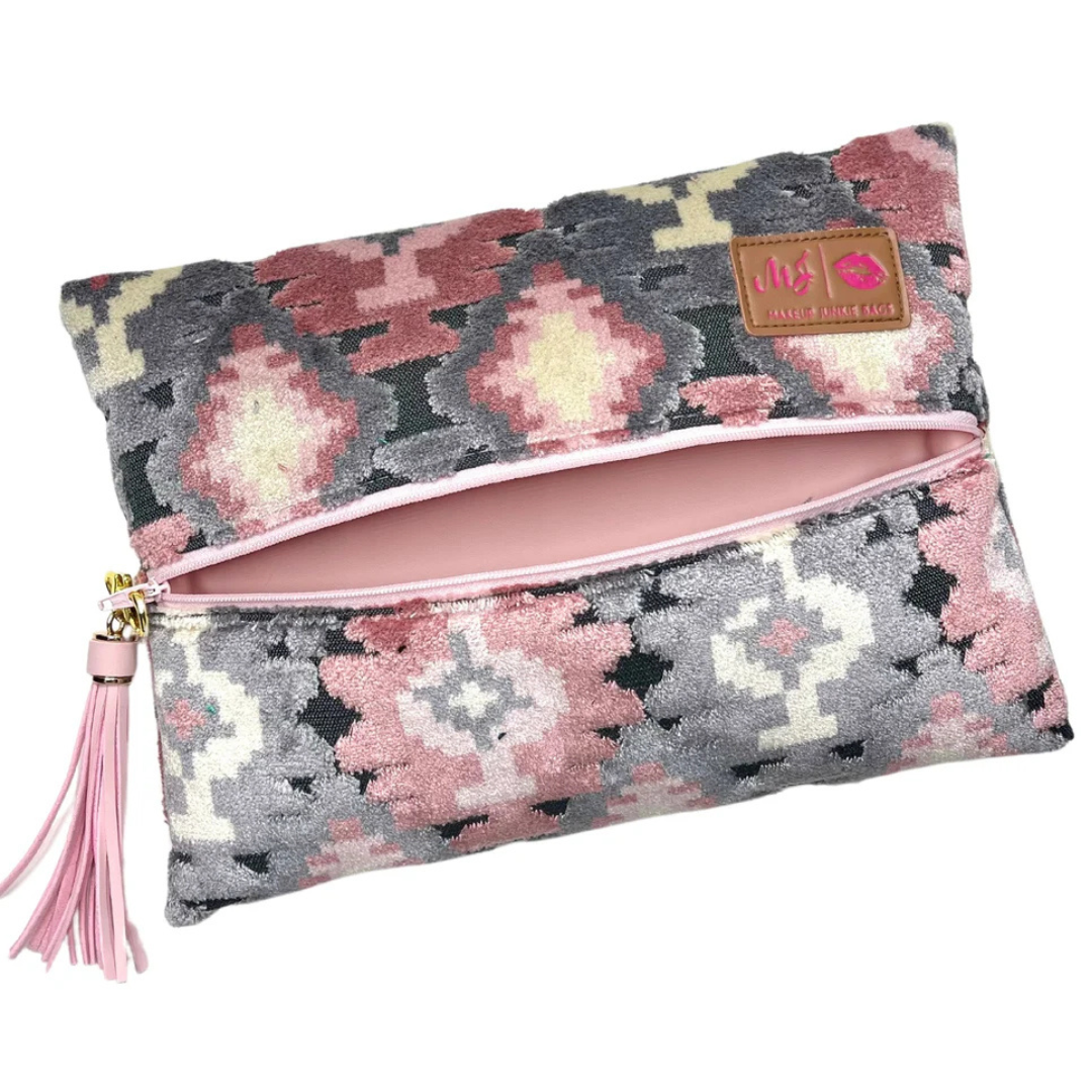 Front view of Aztec Blush travel bag in blush‑pink velvet with blush zipper and matching tassel on luxe cut‑pile fabric.
