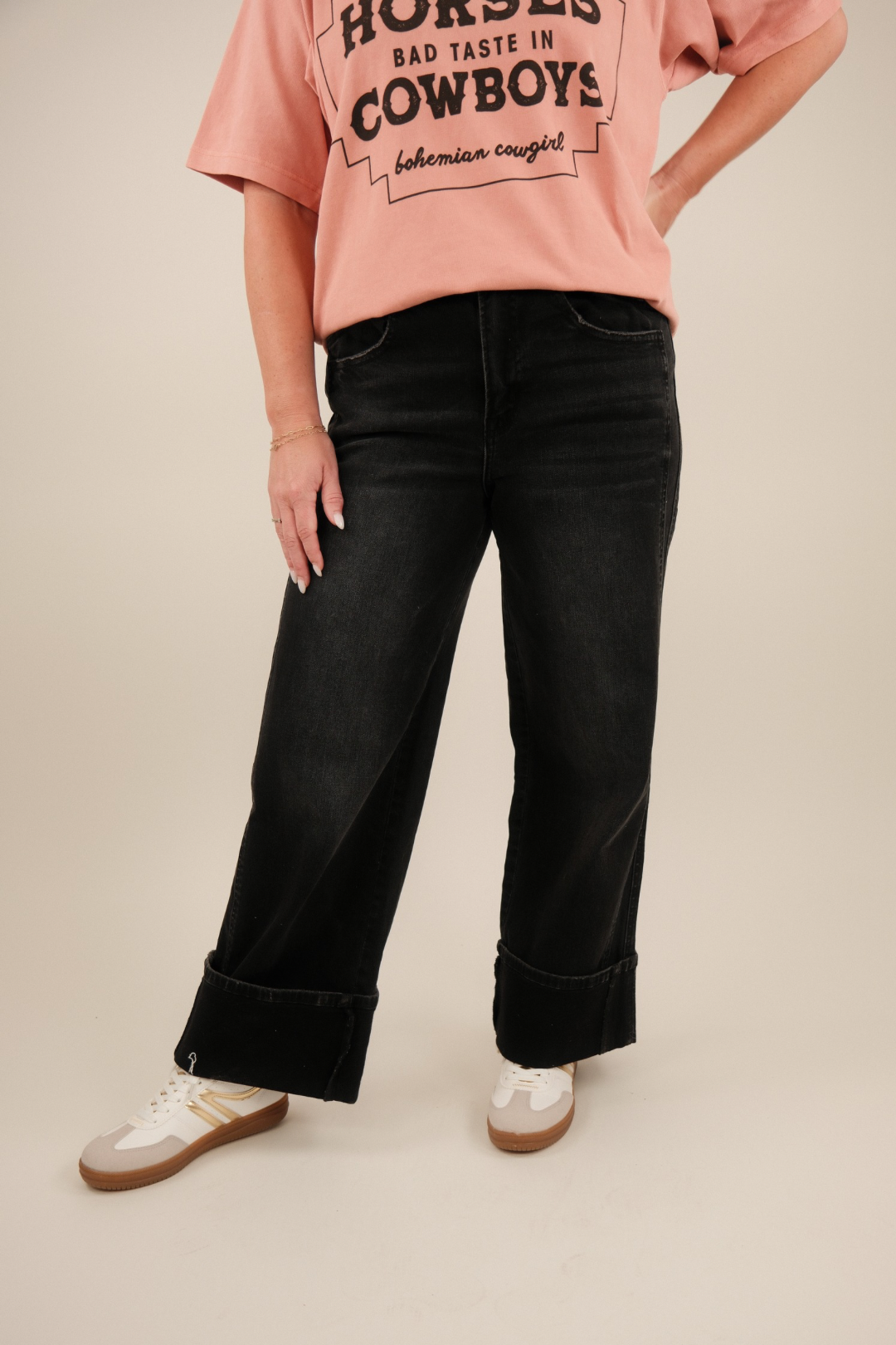 Front view of high‑rise Black Stallion Utility Jeans in washed black denim with double front utility pockets and relaxed wide‑leg cuff.