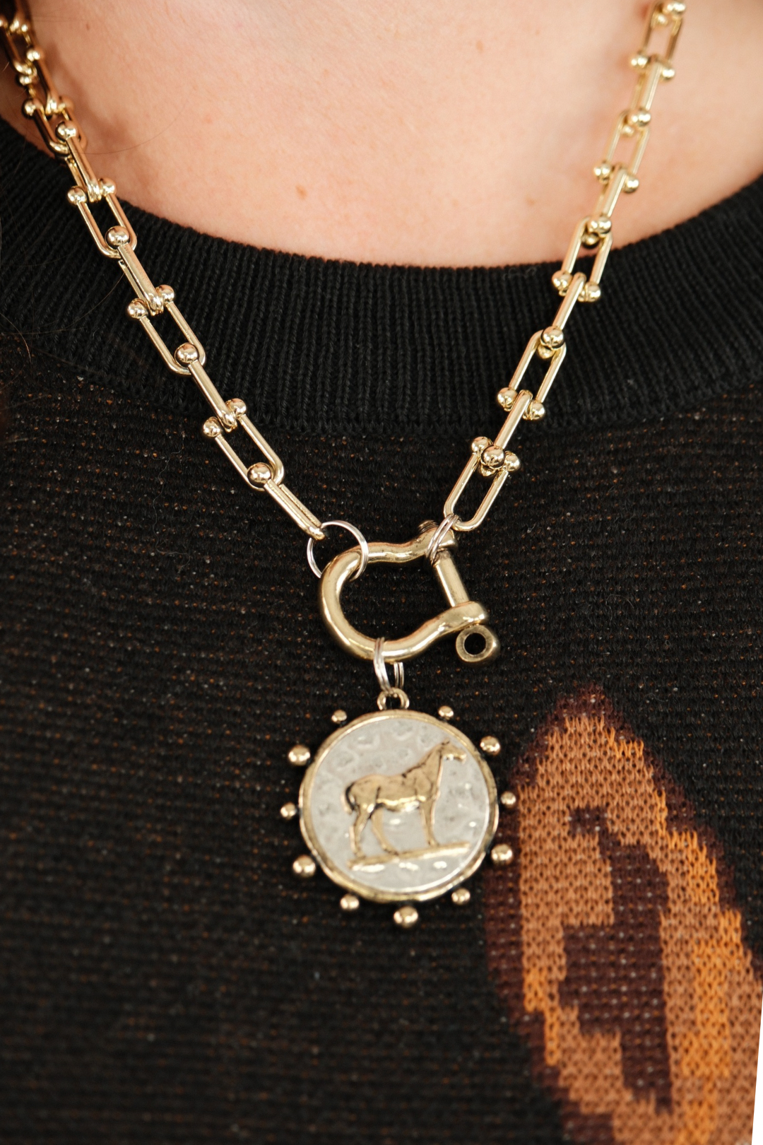 Bridle Path Pendant Necklace in gold, stirrup-style chain with horse pendant — elegant cowgirl jewelry with timeless western charm.