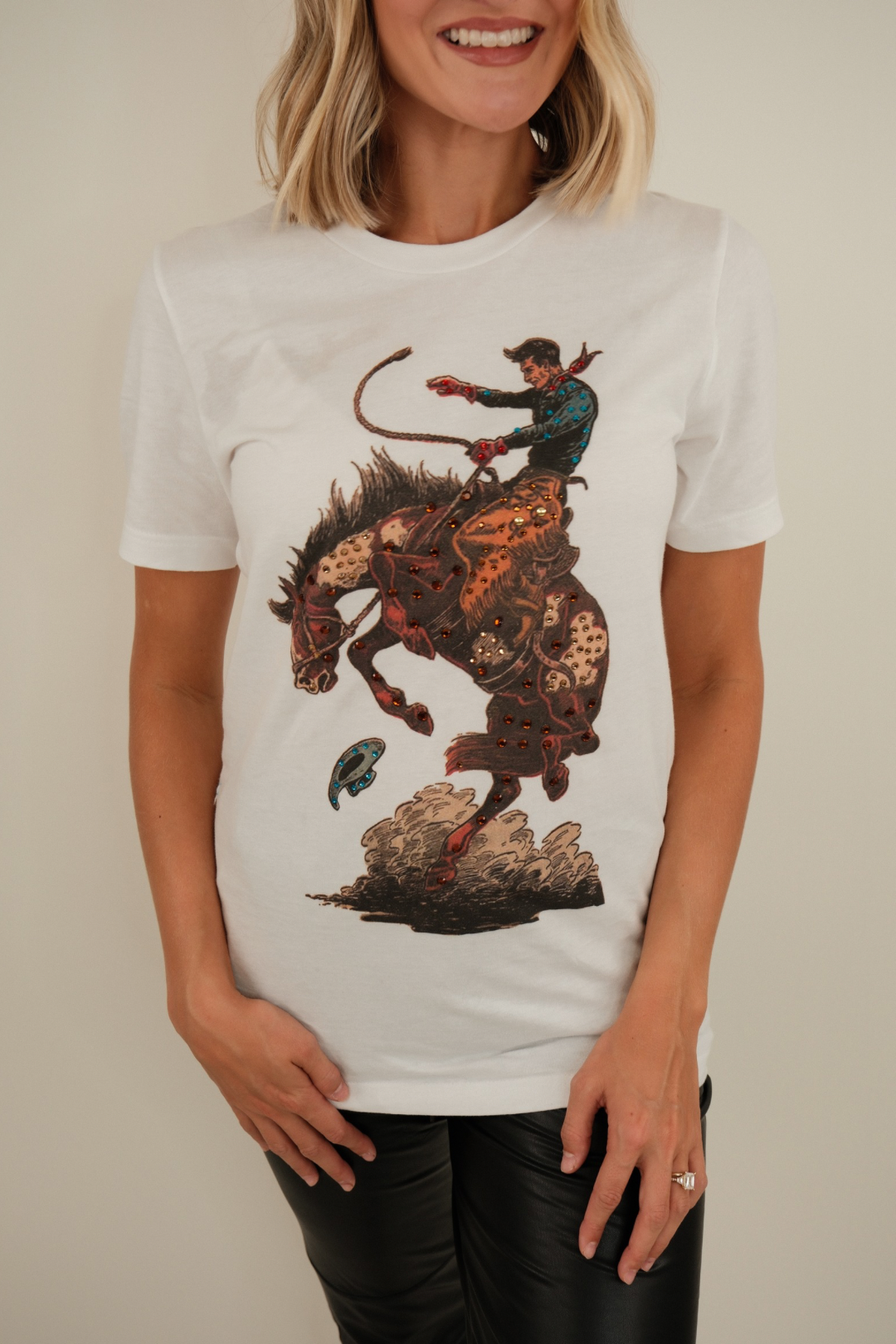 Front view of Bronco Dust Tee in stone-wash brown with western graphic and sparkling rhinestone embellishments.