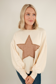 Cream knit Bronze Star pullover with brown star motifs, relaxed western fit and soft sweater texture.