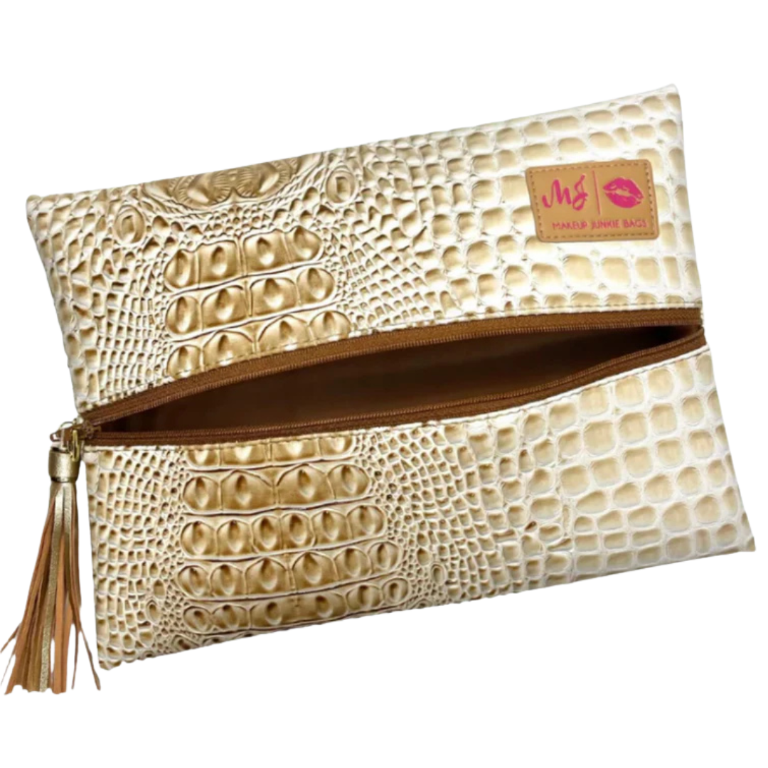 Front view of Bubble Gator Sand flat‑lay bag in sandy tan faux‑gator leather with tan zipper and matching tassel accent.