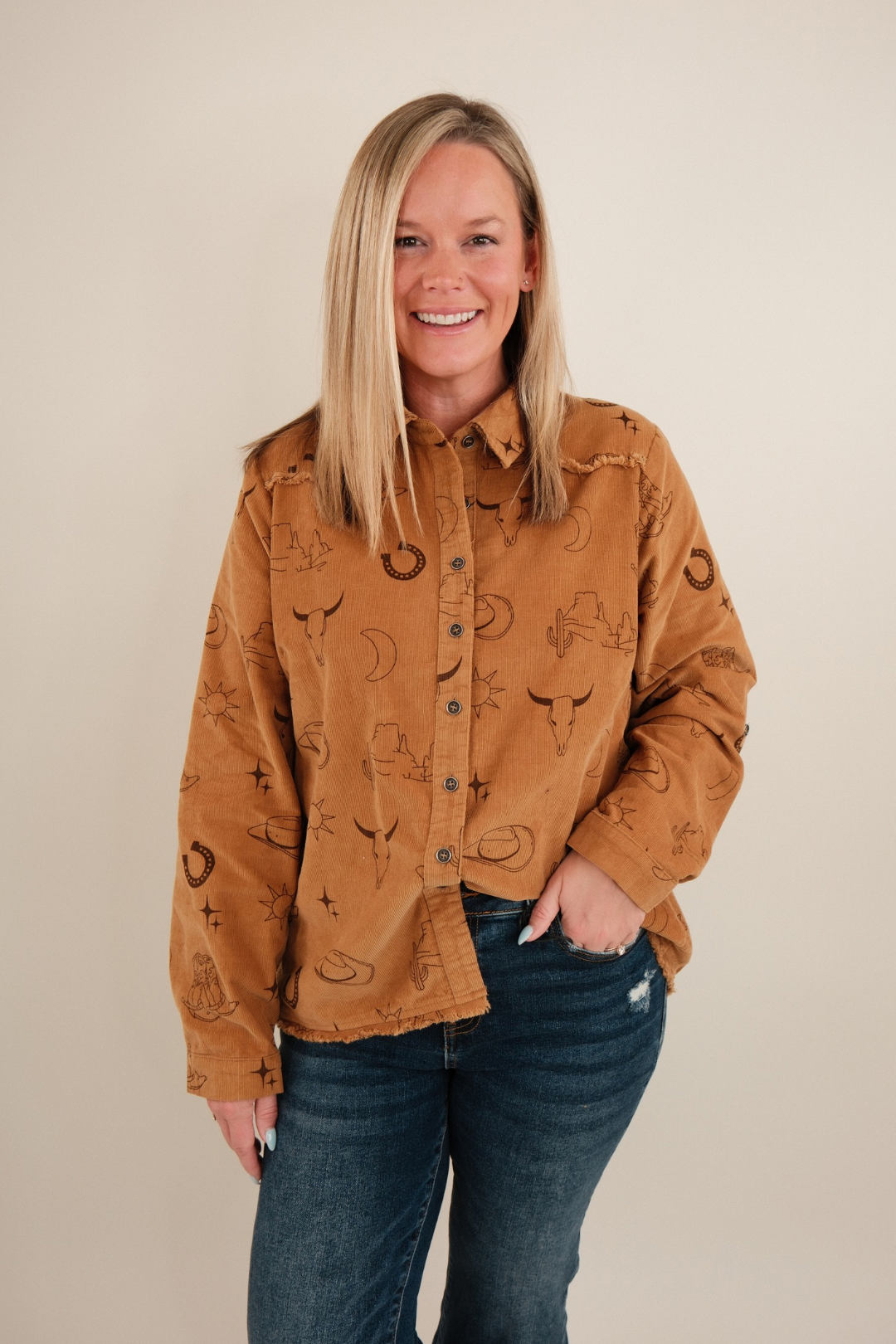 Soft corduroy western shirt in camel with snap buttons, chest pockets & relaxed fit.