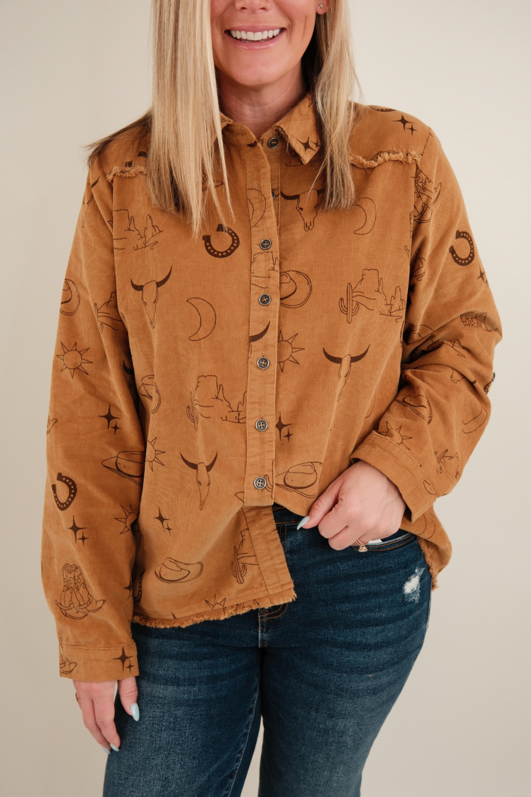 Close-up of camel Canyon Creek Corduroy Shirt highlighting textured corduroy fabric, snap buttons and pocket detail.