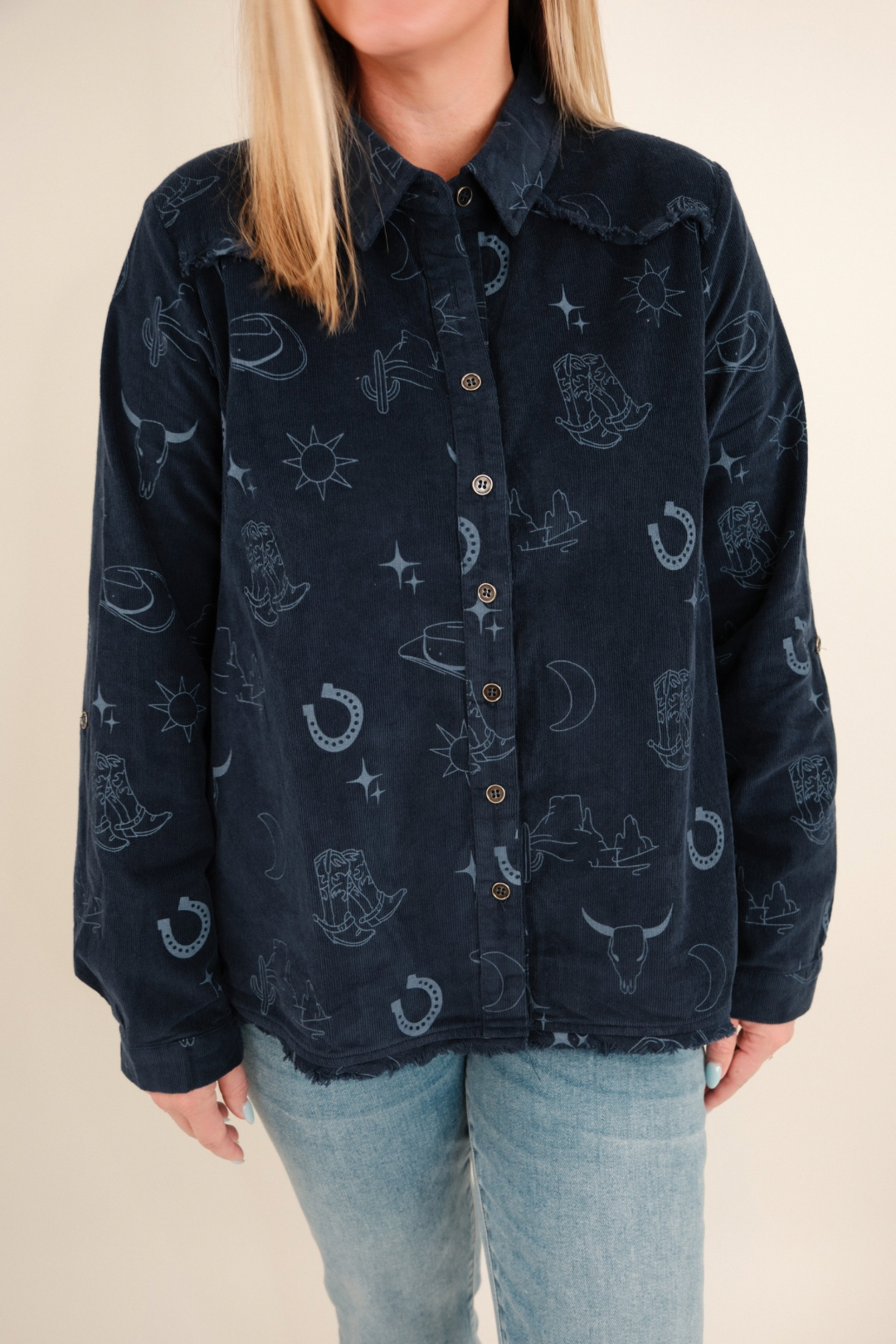 Close-up of denim blue Canyon Creek Corduroy Shirt highlighting textured corduroy fabric, snap buttons and pocket detail.