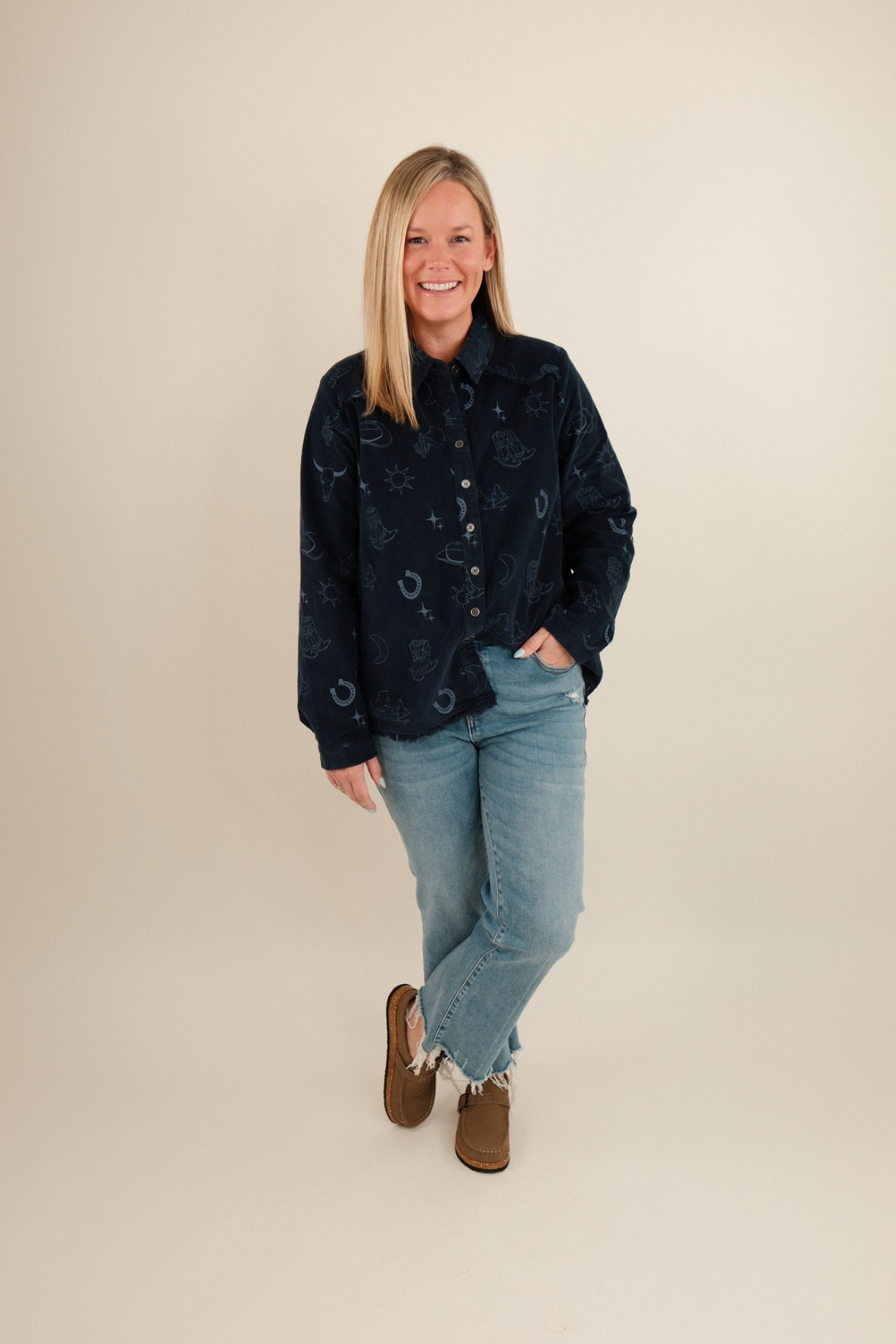 Side profile of denim blue Canyon Creek Corduroy Shirt showing long sleeves, corduroy fabric and cowgirl western style.