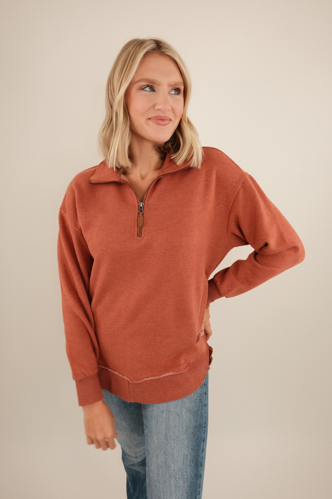 Rich copper Canyon Trail quarter-zip fleece with mock neck, relaxed fit and soft brushed texture.
