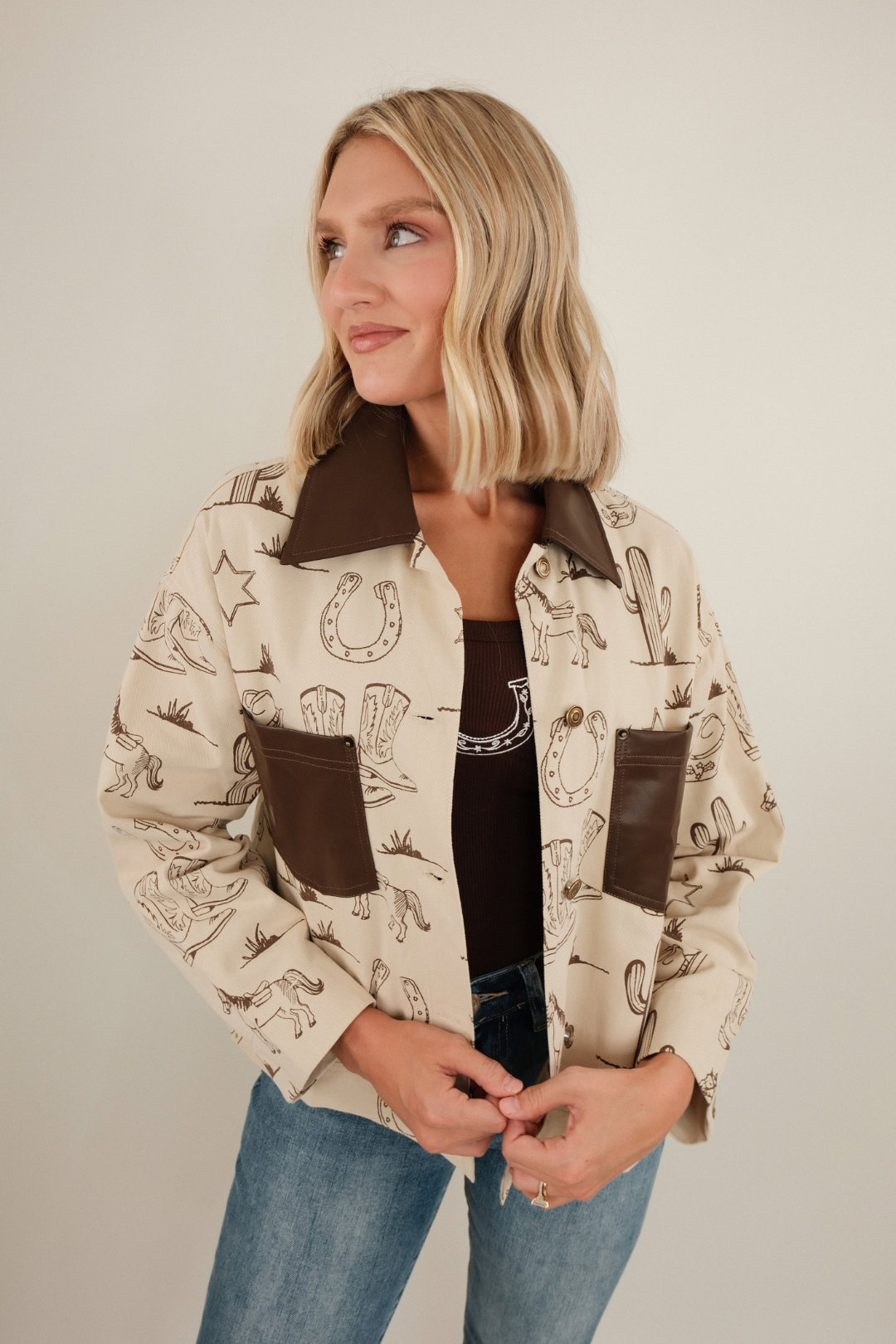Front view of canvas Cowboy Trails jacket with durable construction, Western styling and practical pocket details.