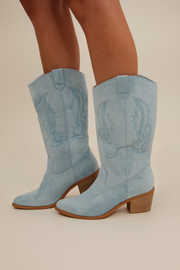 Side profile of Cowgirl Pop Suede Boots in dreamy light blue with pointed toe and western stitched detail.