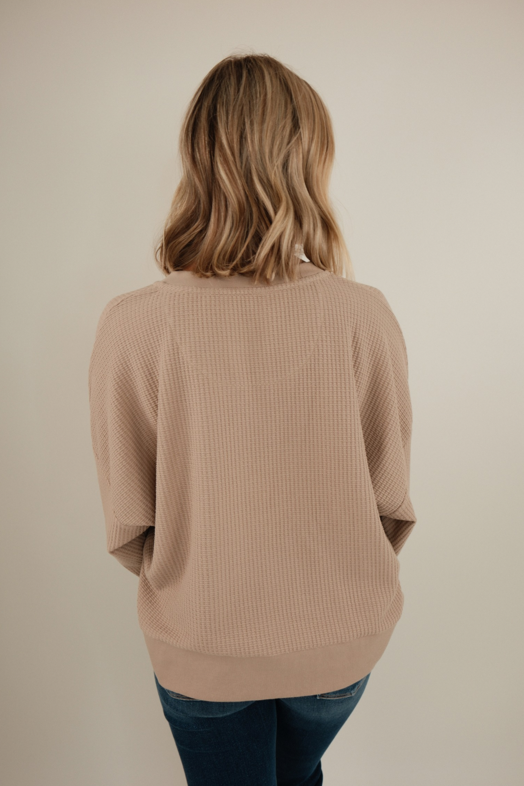 Back view of Desert Dune Waffle Henley in sand-colored waffle knit with long sleeves and relaxed western-inspired silhouette.