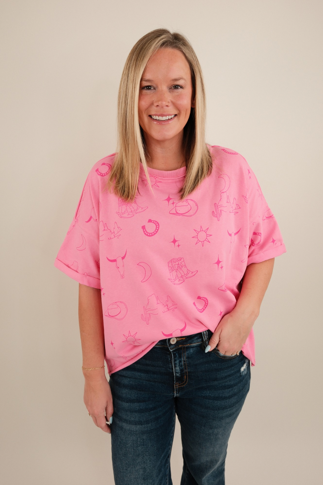 Stone-wash soft pink Desert Shadows tee with relaxed fit, classic crew neckline, and subtle western graphic detailing