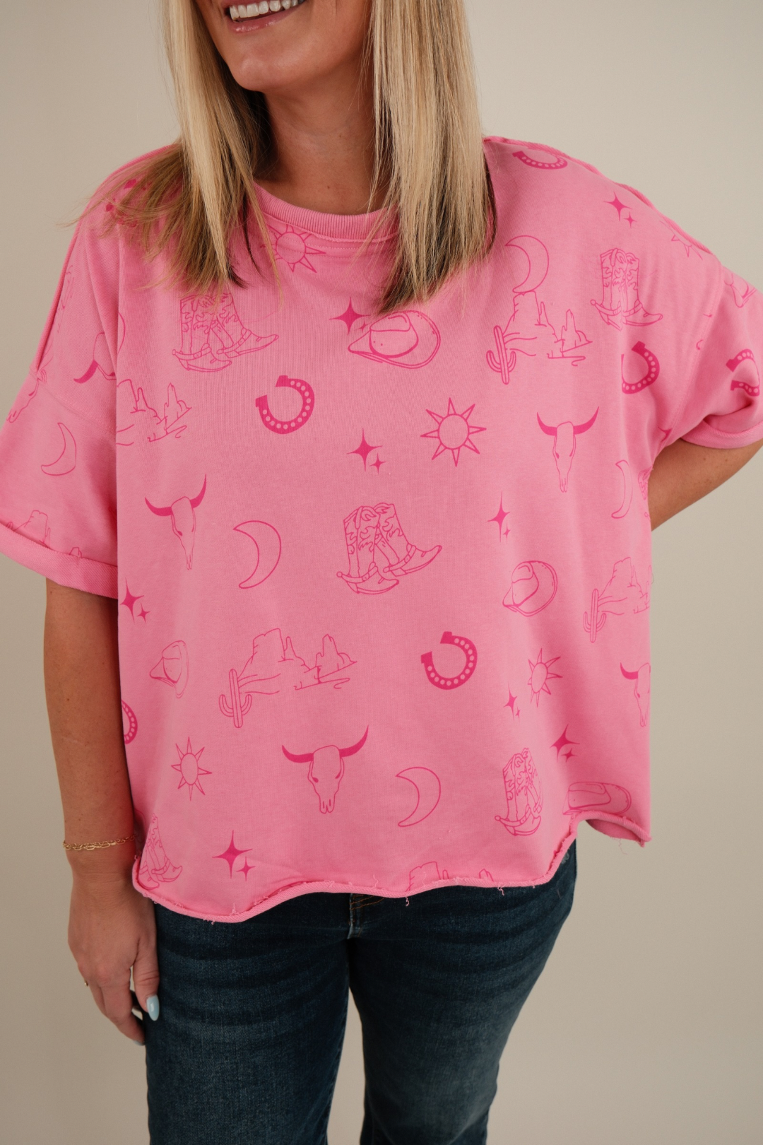 Front view of women’s Desert Shadows Tee in stone-wash pink, western graphic t-shirt with relaxed fit and crew neckline.