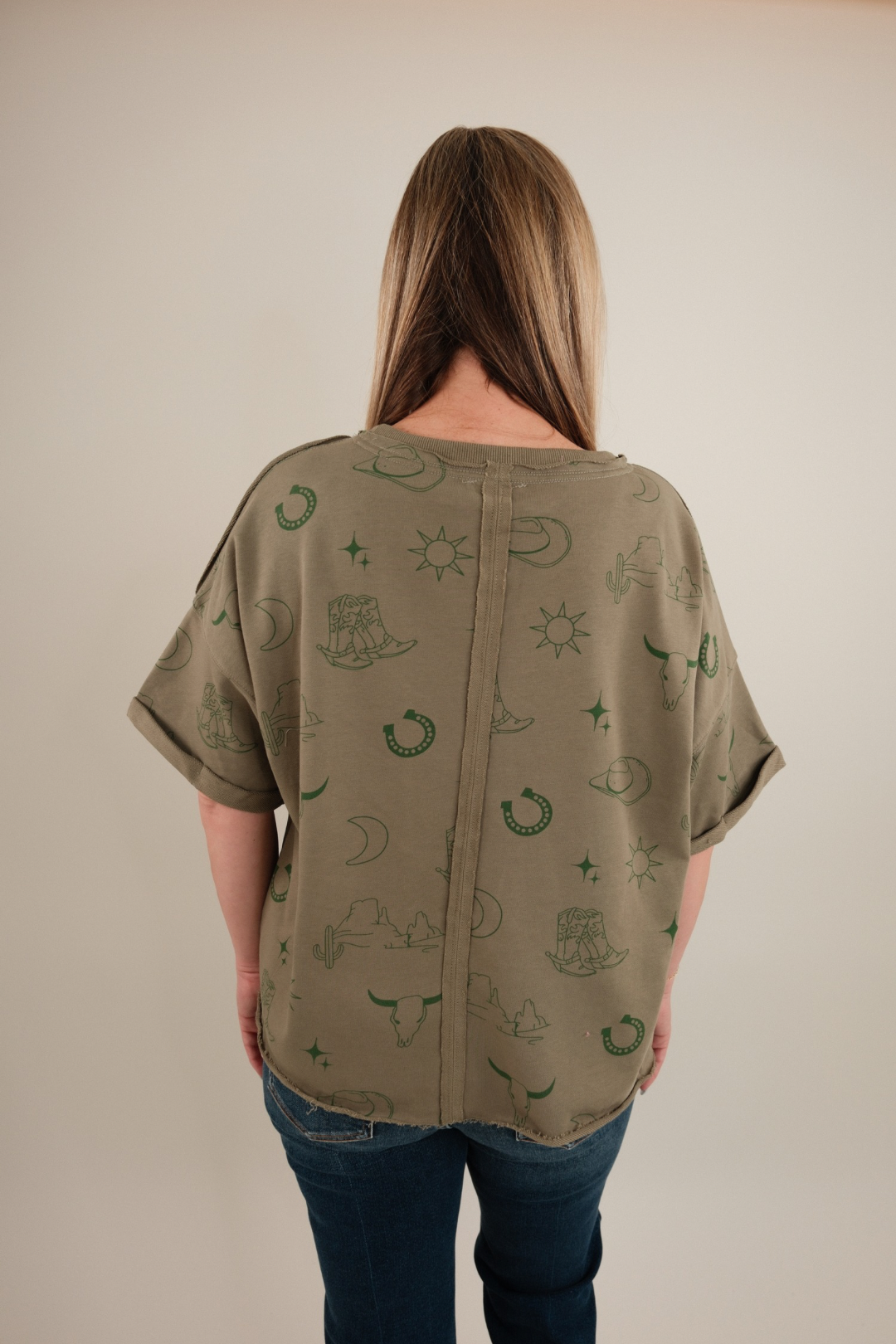 Back view of Desert Shadows Tee, women’s stone-wash green western t-shirt with plain back and relaxed fit.