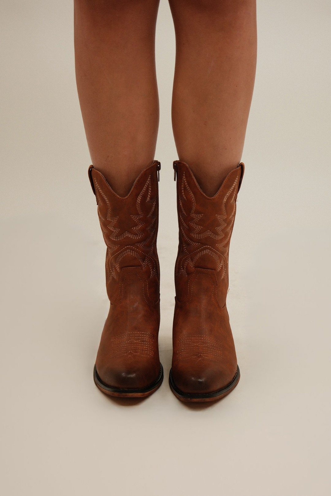 Taupe suede women’s western boots, Ember Range style with side profile showing 2.5-inch stacked heel and embroidery.