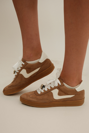 Side profile of Rodeo Sneakers showing cream side detail, brown T-toe, low silhouette and gum sole.