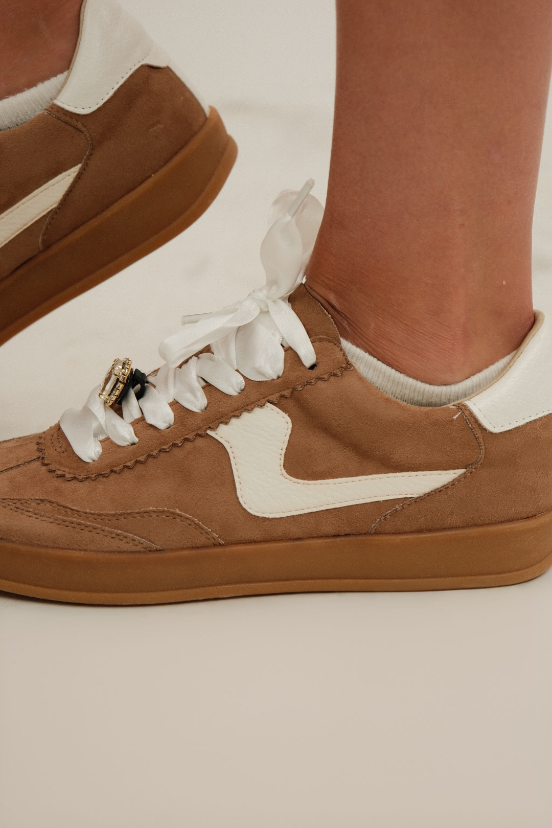 Side view of Gemstone Rodeo Sneakers, brown T-toe with cream side panels and gum sole, western streetwear look.