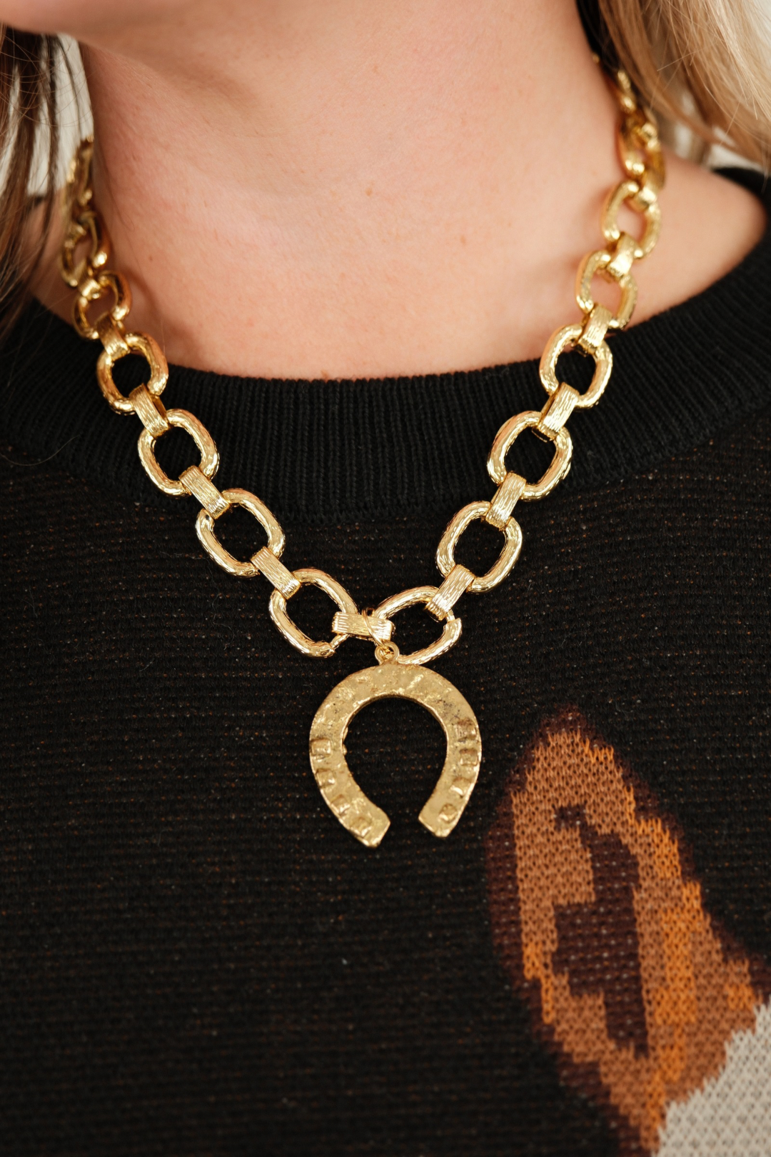 Front view of Golden Luck Link Necklace featuring textured gold chain and matching gold horseshoe pendant for timeless western elegance.