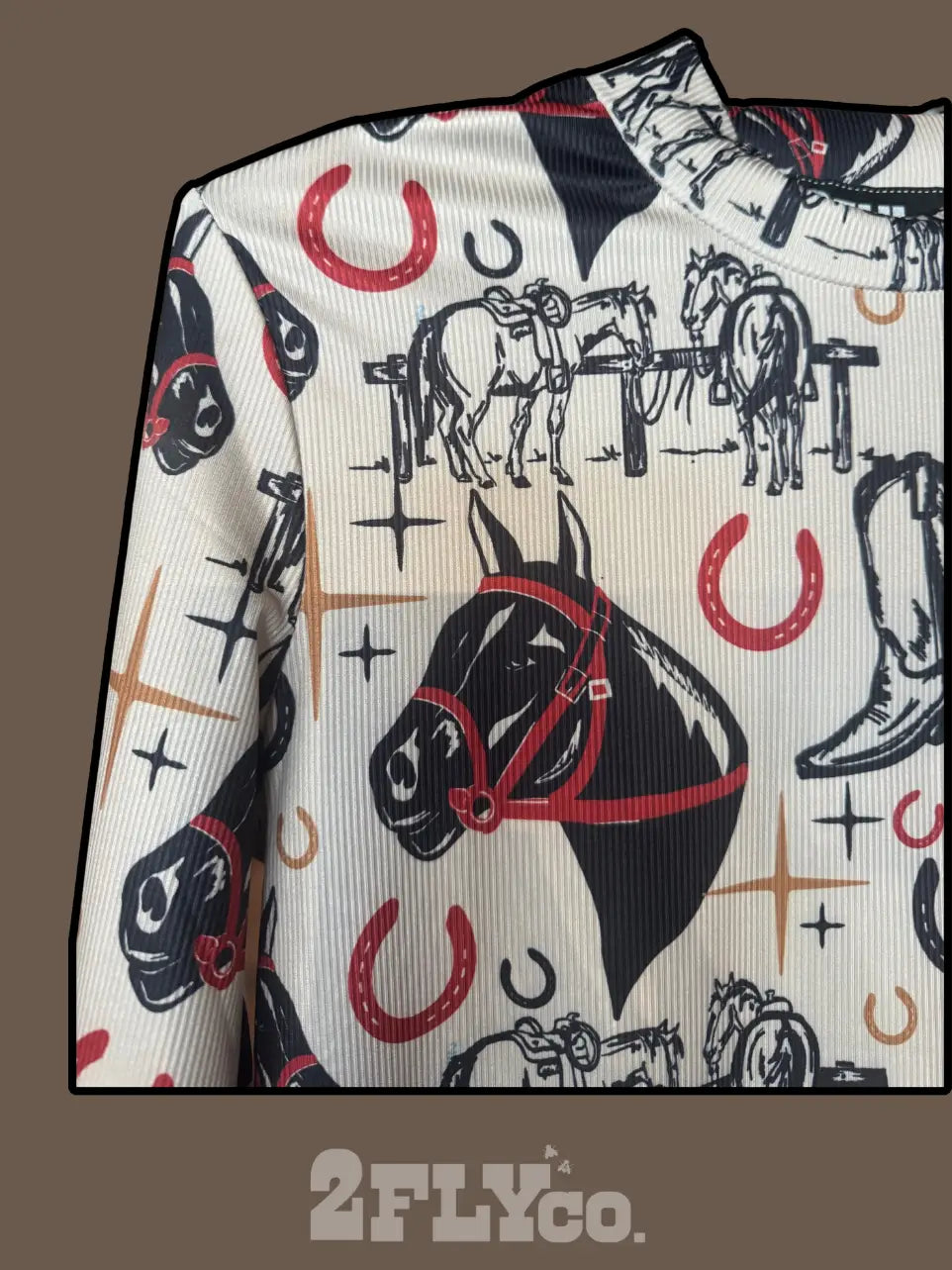 Close-up of Head Over Heels Ribbed Top highlighting hand-drawn horse head and horseshoe print on soft ribbed fabric in beige and red tones.