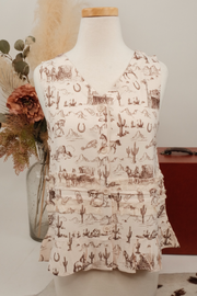 Cream sleeveless top with brown desert pattern on a mannequin against a neutral background