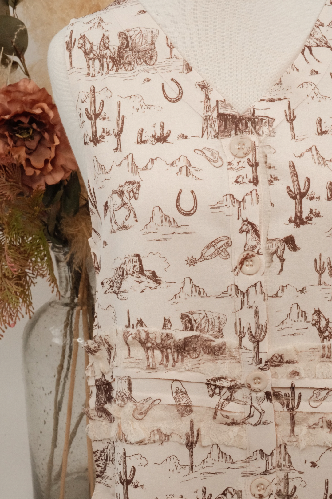 Cream vest with brown western designs