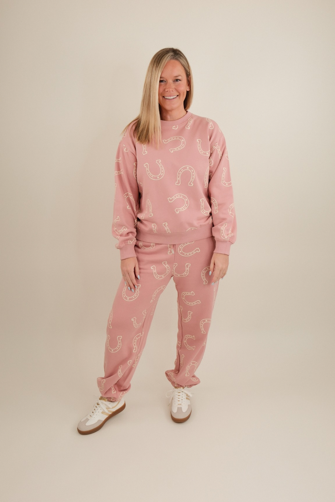 Front view of Horseshoe Haven Lounge Set in light mauve with cream horseshoe print, pullover sweatshirt and high-waisted joggers.