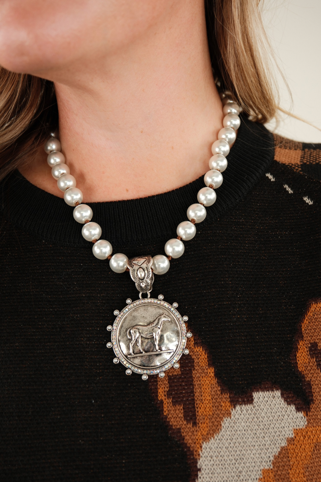 Iridescent Rider Pearl Necklace featuring grey pearl strand and horse pendant framed in iridescent stones — elegant western cowgirl jewelry.