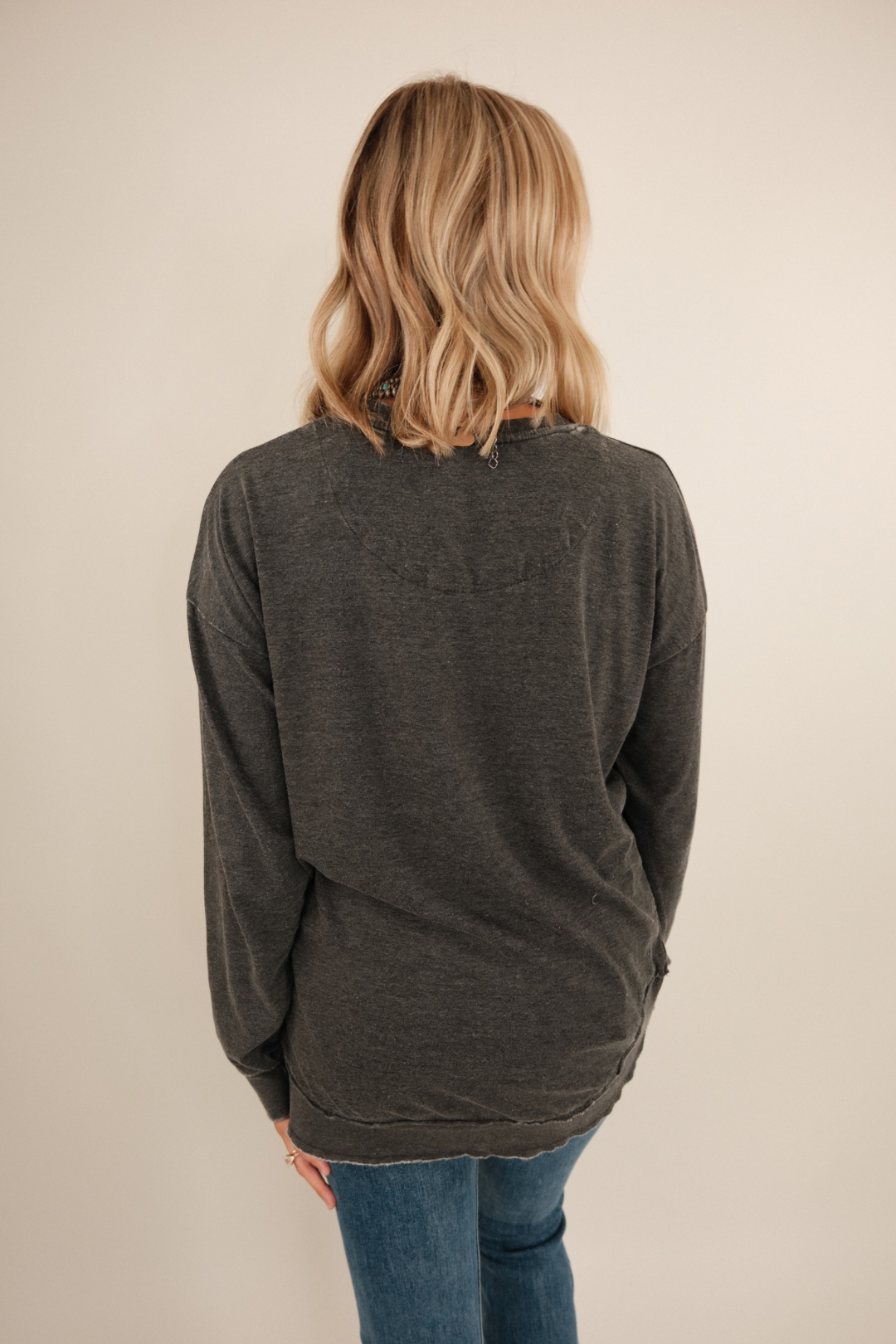 Back view of Long Sleeve Vintage Washed Poncho Tee in charcoal vintage wash with oversized poncho-style drape.