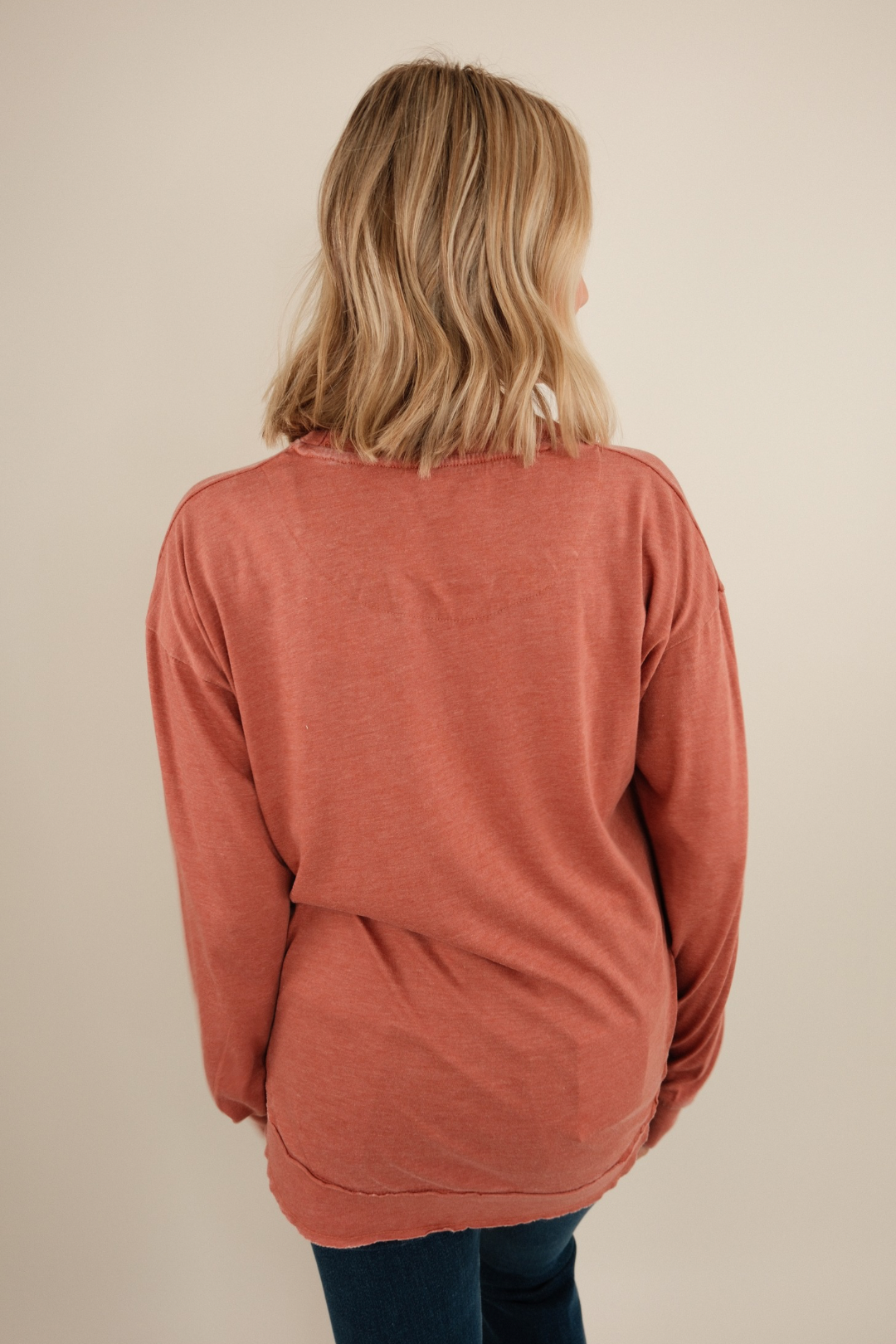 Back view of Long Sleeve Vintage Washed Poncho Tee in brick vintage wash with oversized poncho-style drape.