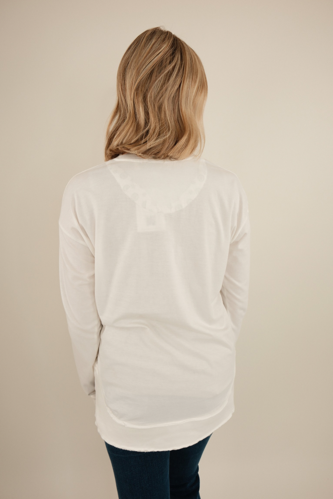 Back view of Long Sleeve Vintage Washed Poncho Tee in ivory vintage wash with oversized poncho-style drape.
