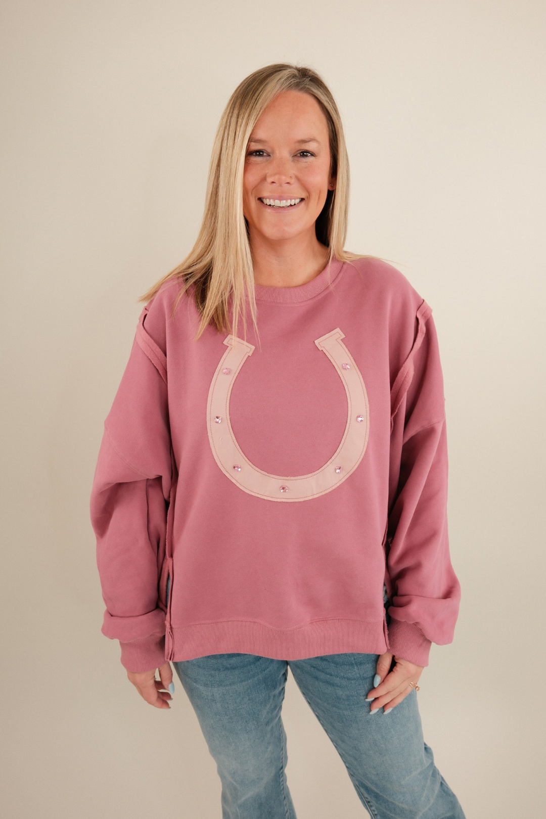 Lucky Charm Pullover in mauve with cream horseshoes, stars, and sparkling pink gemstone embellishments for cowgirl chic.