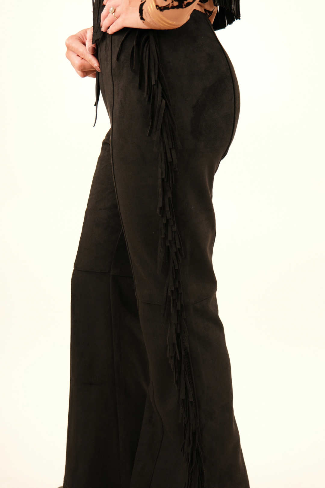 Black suede fringe pants with cascading fringe trim and western flare silhouette