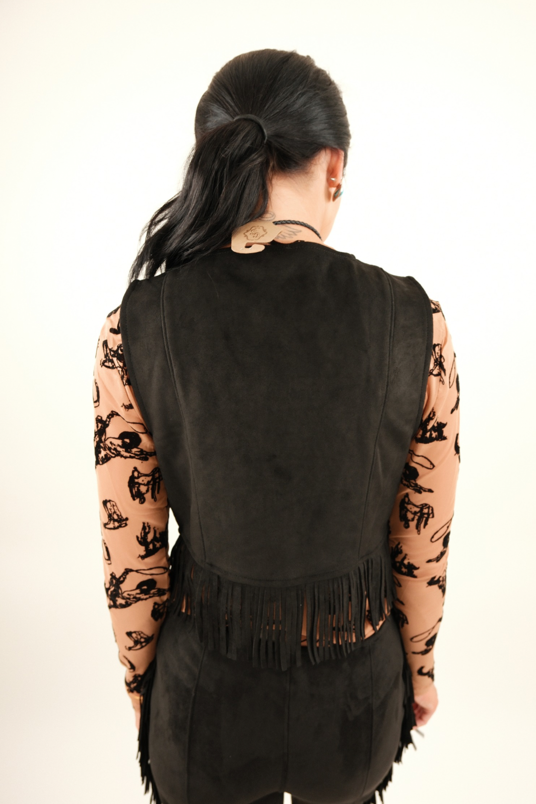 Back view of Midnight Fringe Suede Vest, luxe black suede vest with high-rise pants and western fringe trim.