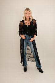 Front view of Midnight Range Mesh Duster, sheer black maxi with embroidered horses, saddles and western motifs for dramatic cowgirl style.