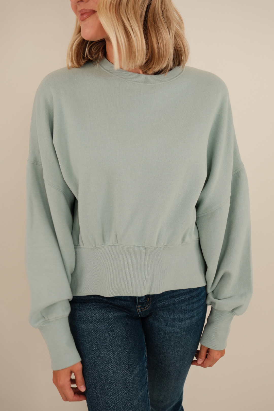 Front view of Misty Sky Waist-Length Fleece in soft sky blue with scoop neck, long sleeves and relaxed fit.