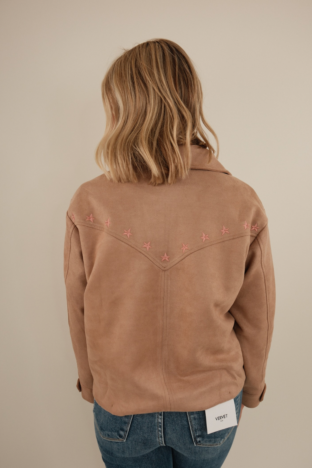 Back view of Mocha Mirage suede jacket showing clean yoke lines and full suede paneling.