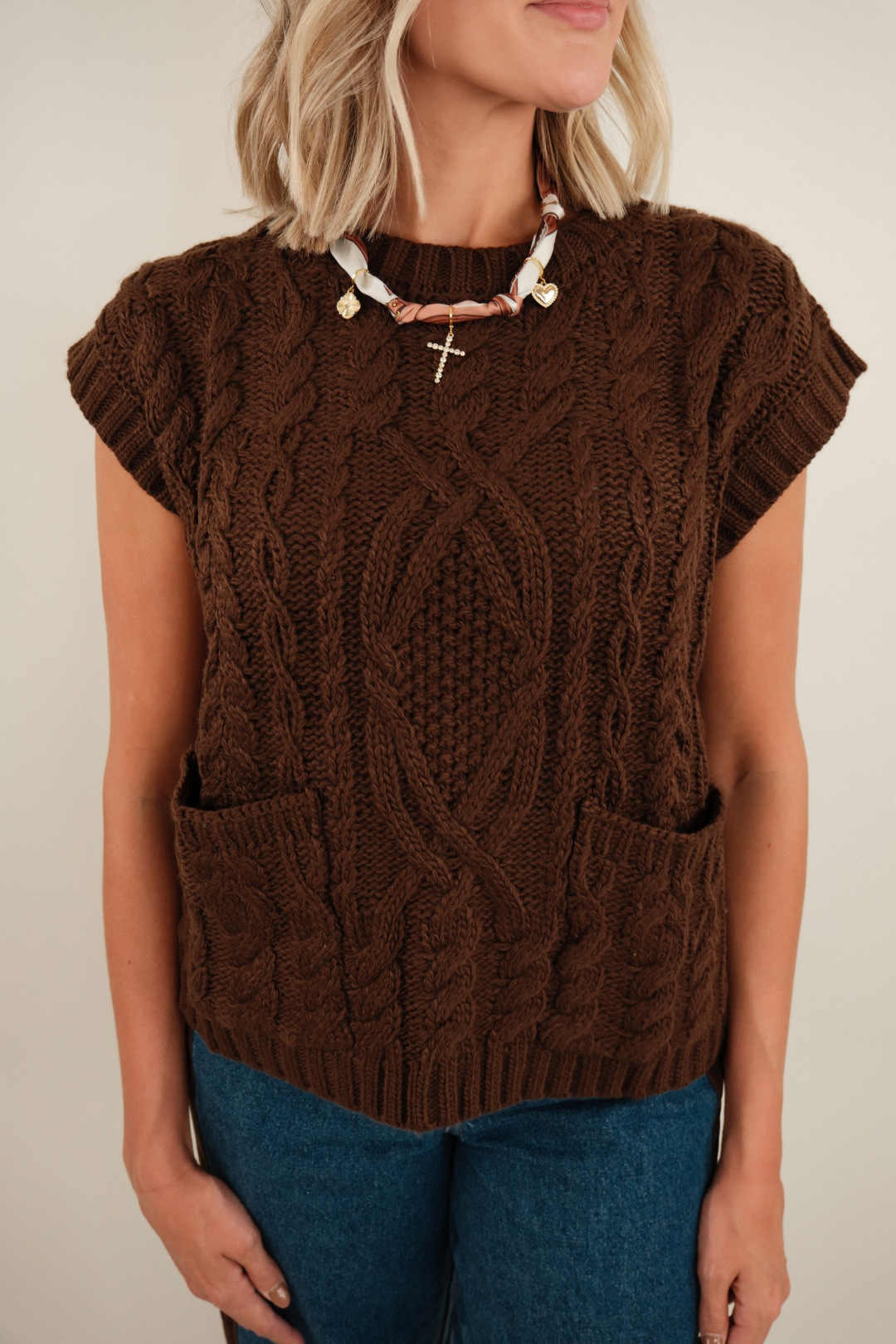 Front view of women’s Mocha Trail Knit sweater, soft mocha brown with v-neckline and relaxed fit.