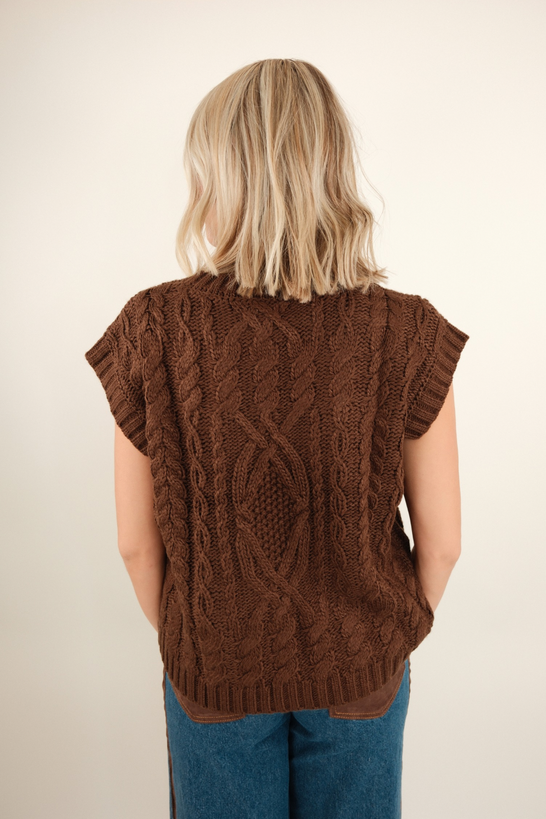 Back view of women’s Mocha Trail Knit sweater, mocha brown with ribbed cuffs and relaxed silhouette.