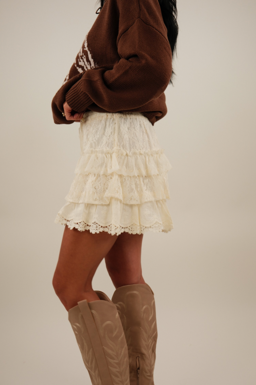 Side profile of cream Prairie Petal Tiered Lace Shorts showing flirty tiered lace and skirt-like silhouette.
