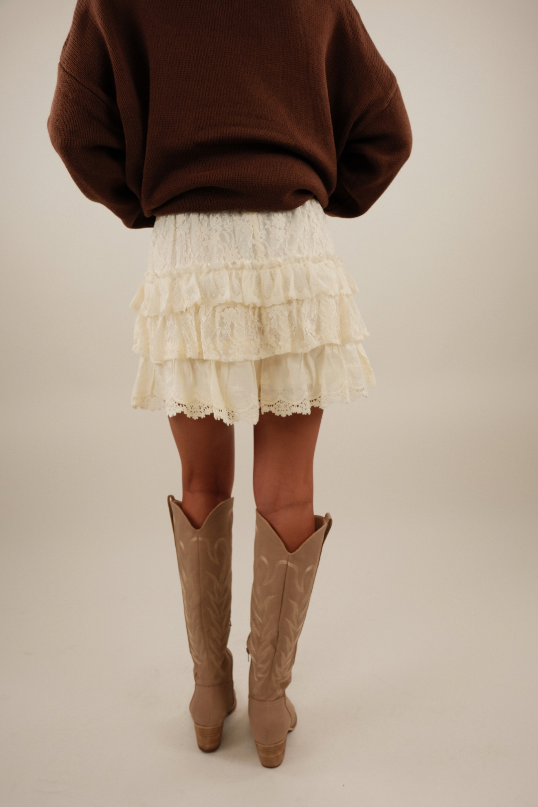 Back view of Prairie Petal Tiered Lace Shorts in cream with tiered lace layers and comfortable elastic waist.
