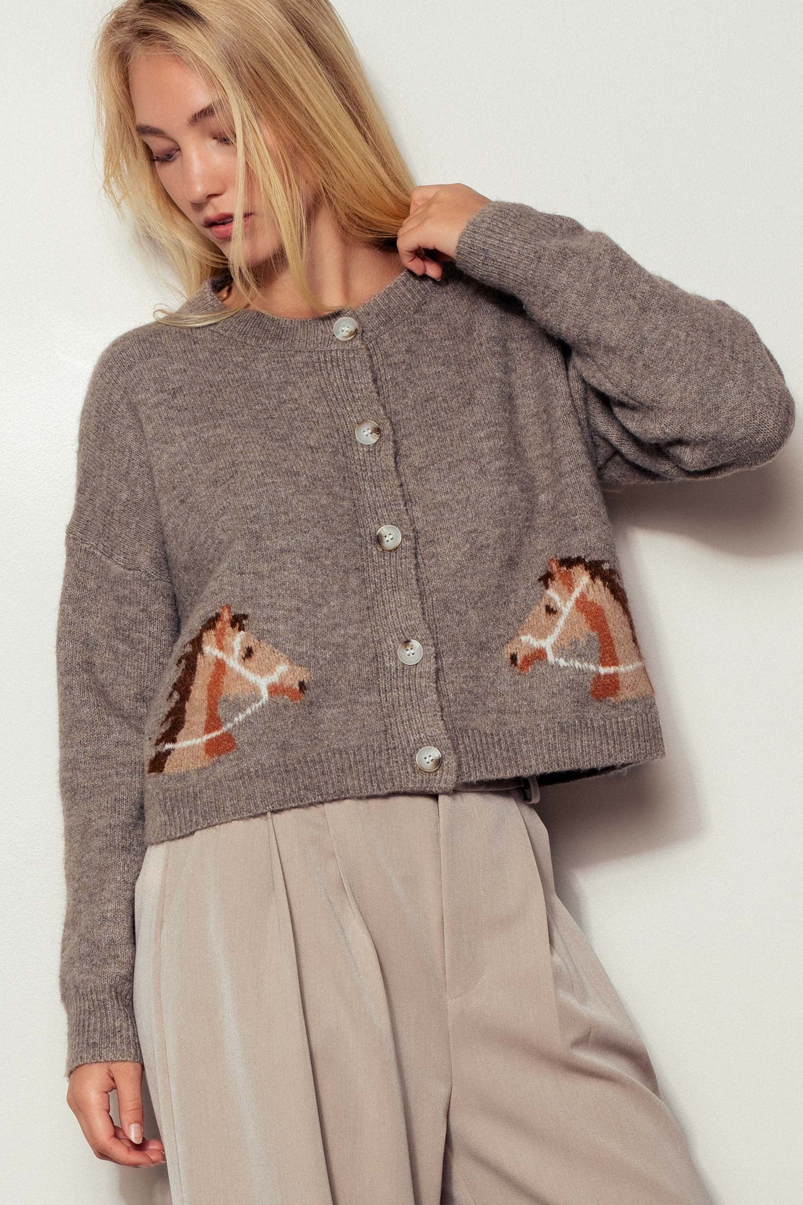 Front view of Reined In Cardigan, light mocha knit button-up with bridled horse head design and cropped feminine western silhouette.