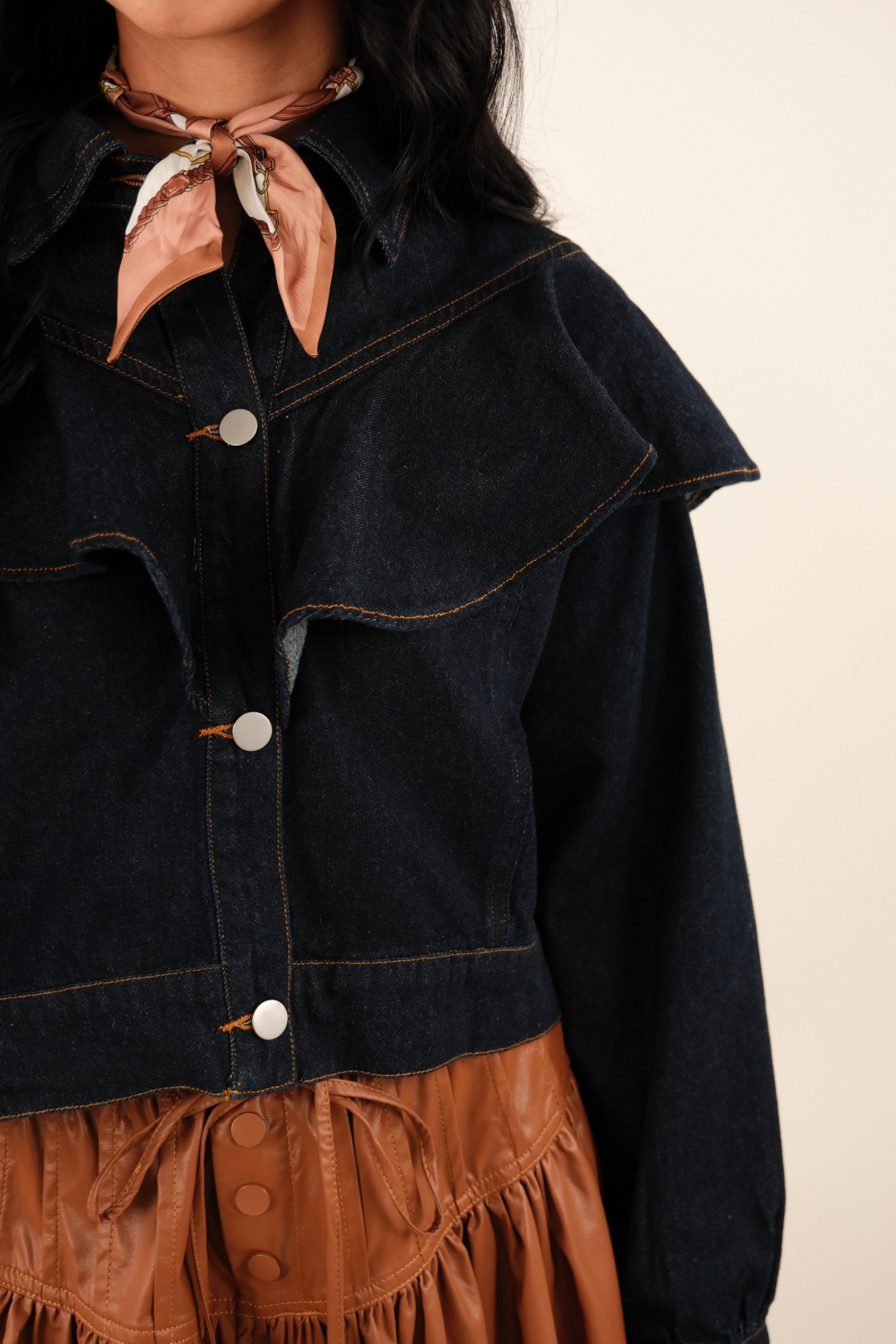 Cropped Rodeo Ruffle Denim Jacket in dark wash with bold ruffle detail across chest, shoulders, and back for a dramatic western cowgirl look.