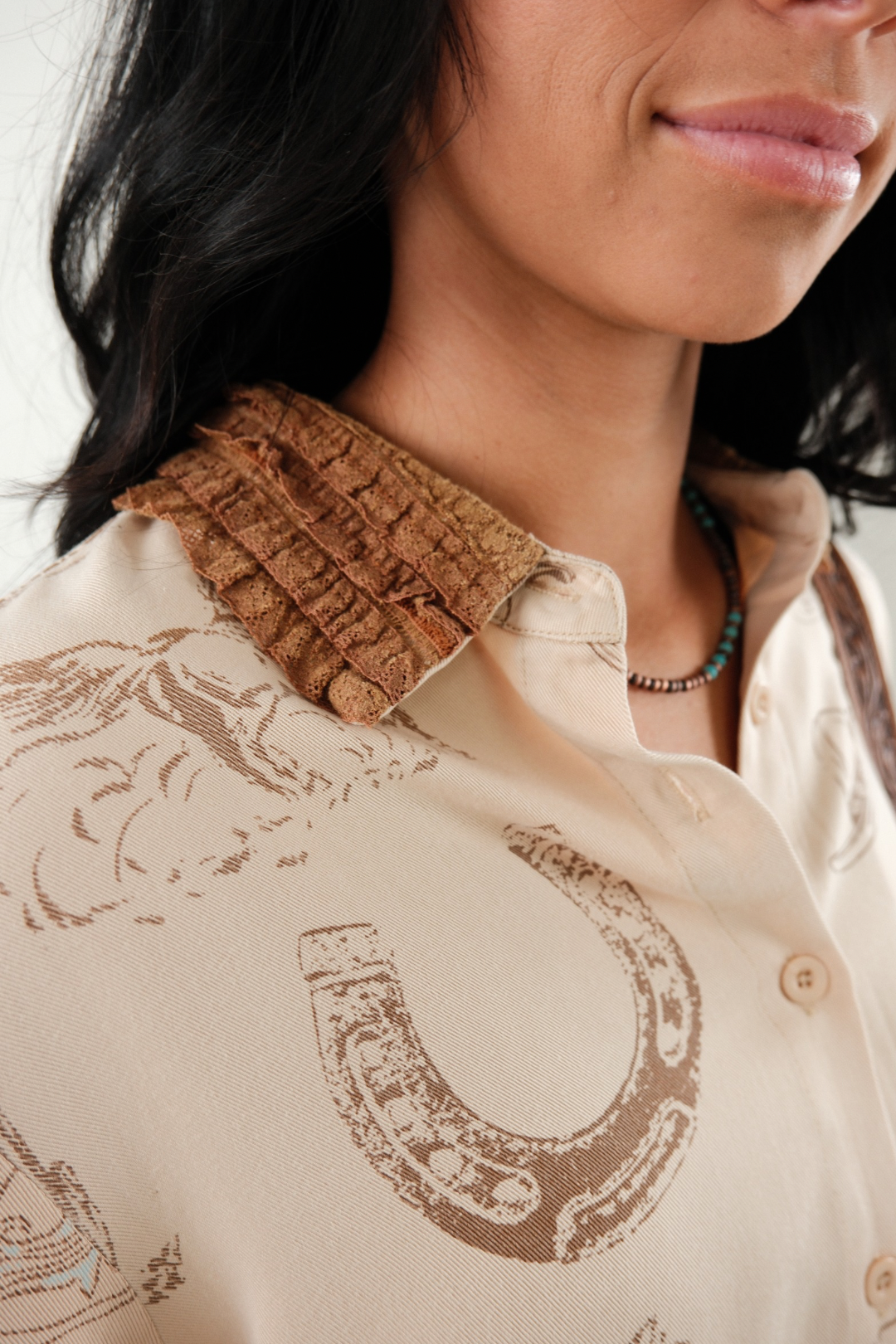 Detail shot of Saddle Lace Button-Up showing feminine-meets-western design with motif print and lace-trimmed collar.