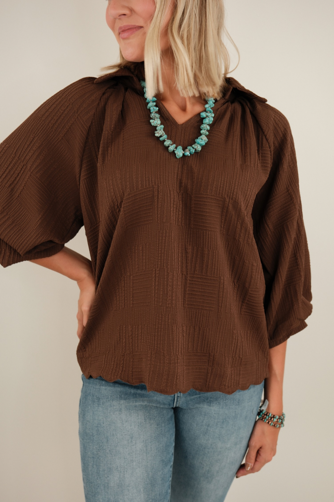 Close-up of Saddle Mocha Blouse highlighting textured mocha brown fabric, western v-neckline and structured collar detail.