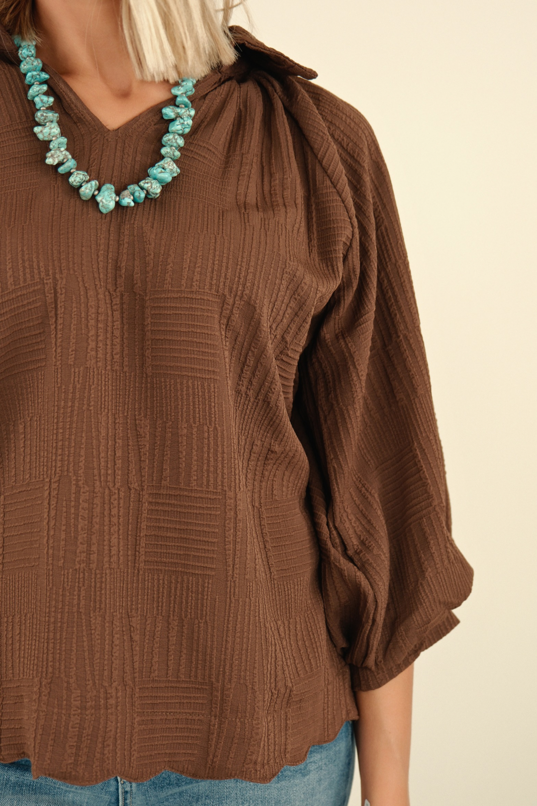 Side view of women’s Saddle Mocha Blouse in rich mocha brown, relaxed fit long sleeve western blouse with elastic cuffs.