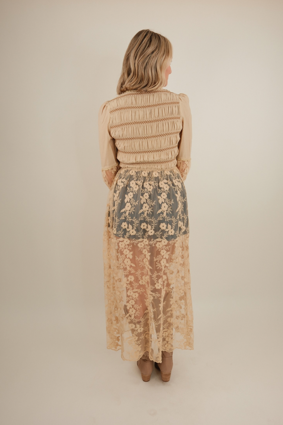 Back view of women’s Saddlewood Lace Duster, western maxi lace cardigan with soft cotton bodice and sheer floral lace skirt.