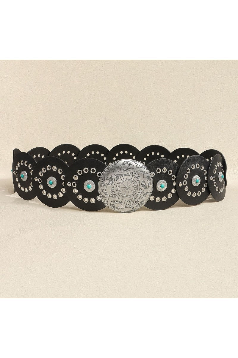 Decorative belt with black scalloped edge and silver medallions and turquoise stones on a beige background