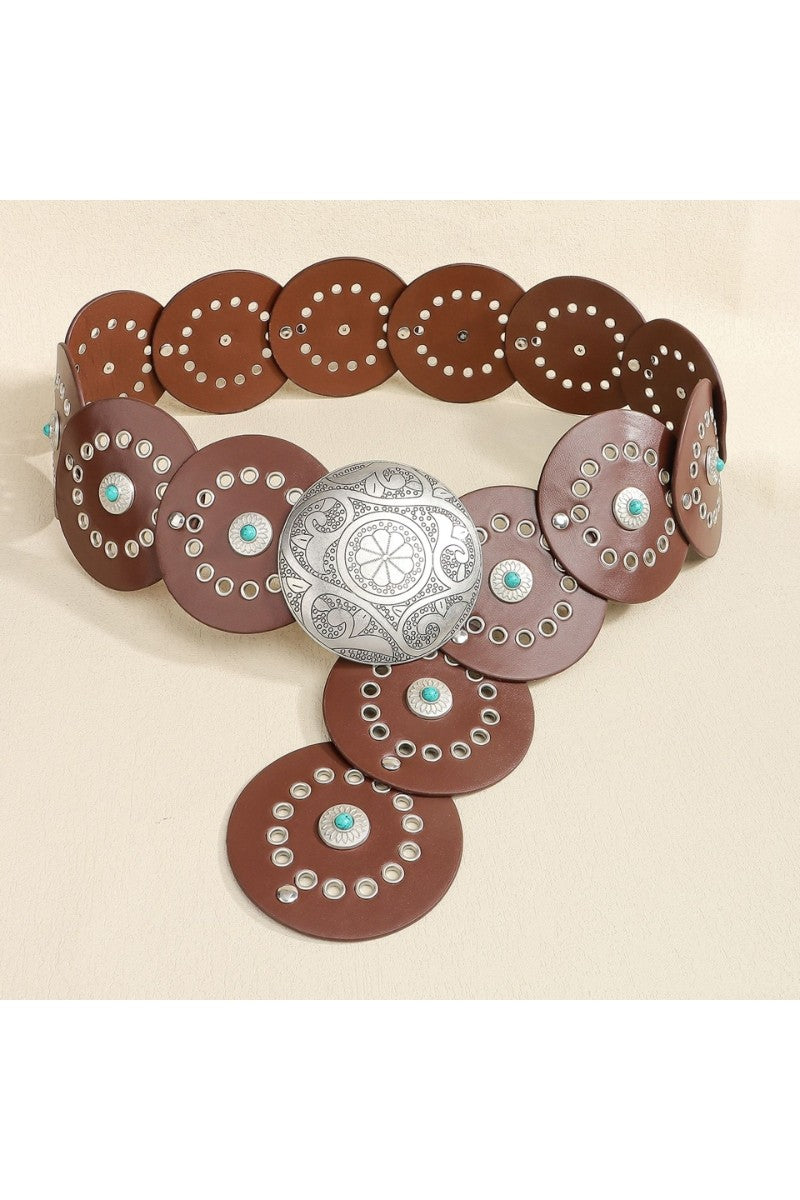 Brown leather belt with silver concho and turquoise stones on a beige background