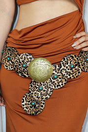 Brown dress with decorative belt featuring leopard print and turquoise stones.